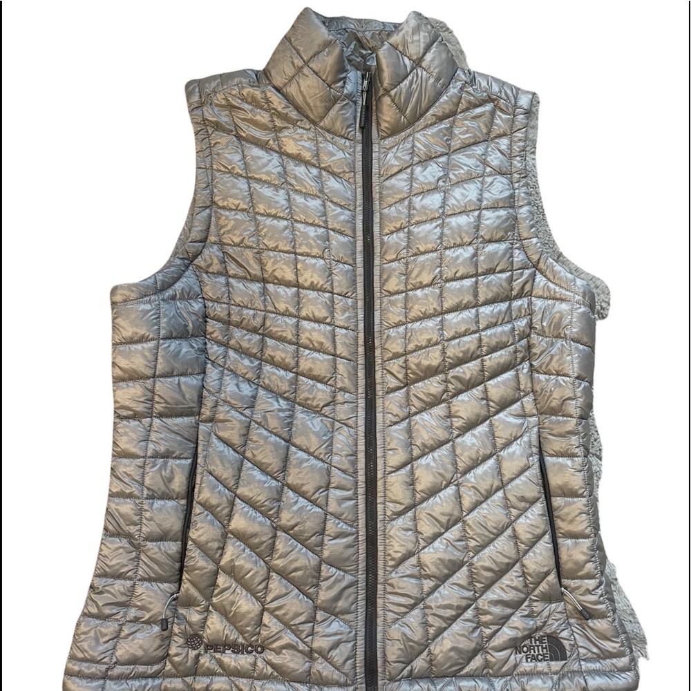 Womens The North Face silver/grey full zip vest.
